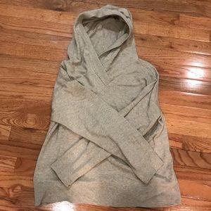 A greyish, cream pullover sweater